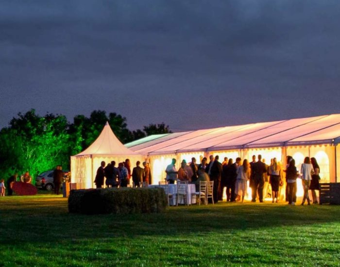 marquee all lit up in the evening from the interior lights.