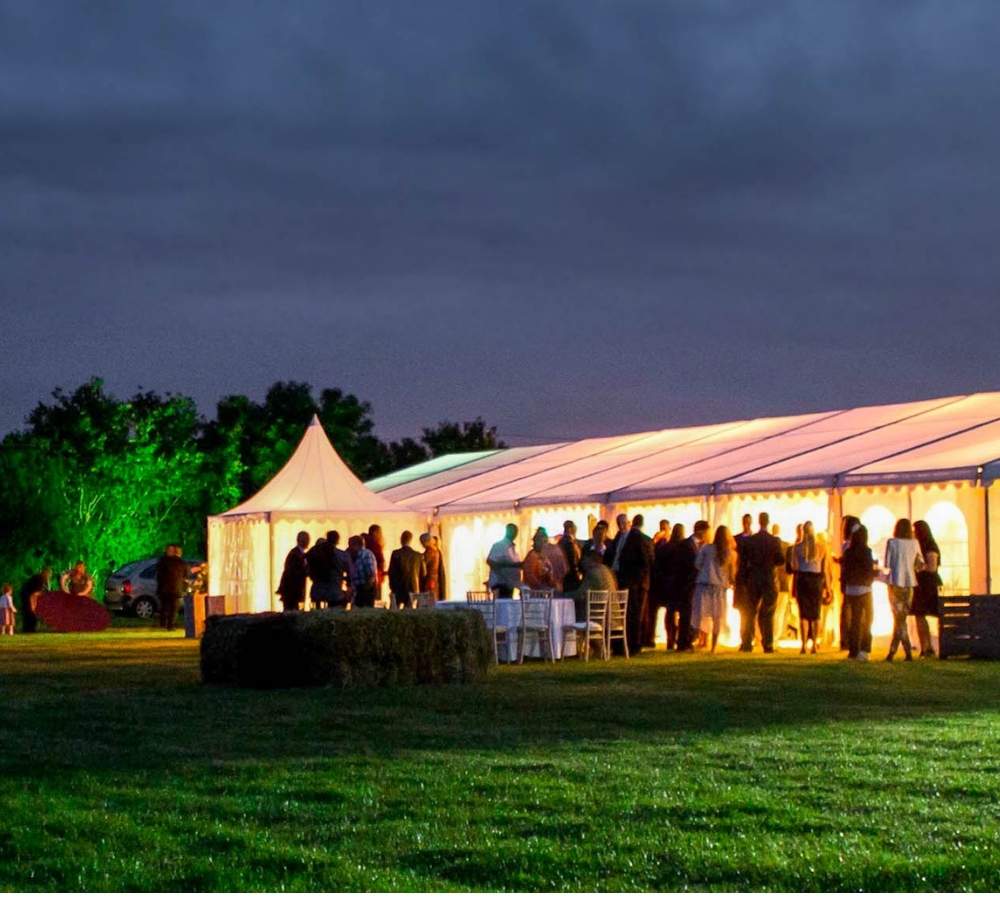 marquee all lit up in the evening from the interior lights.