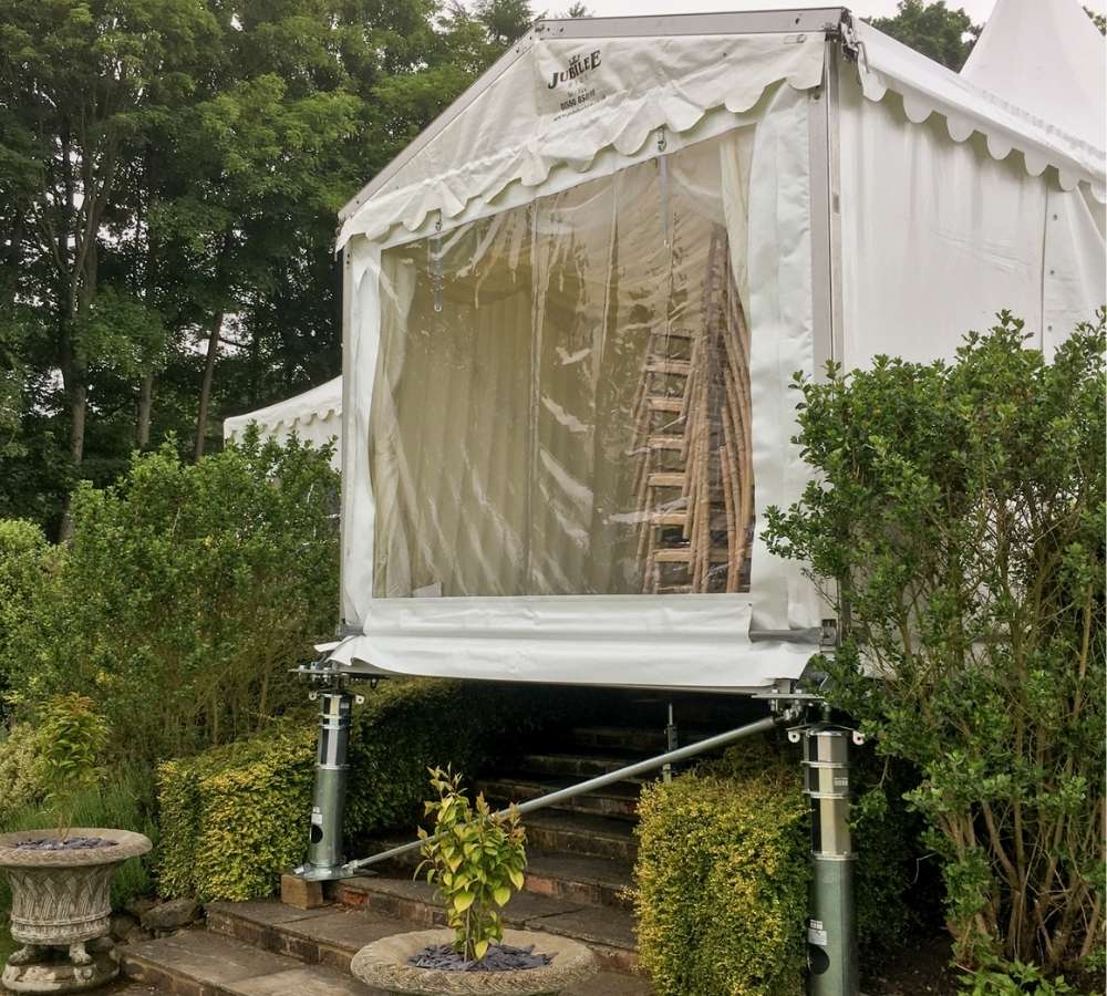 Marquee suspended using hard flooring over some steps